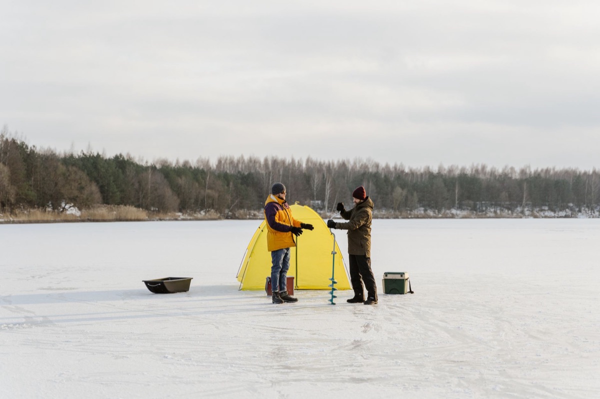 Luar fishing equipment on lake shore