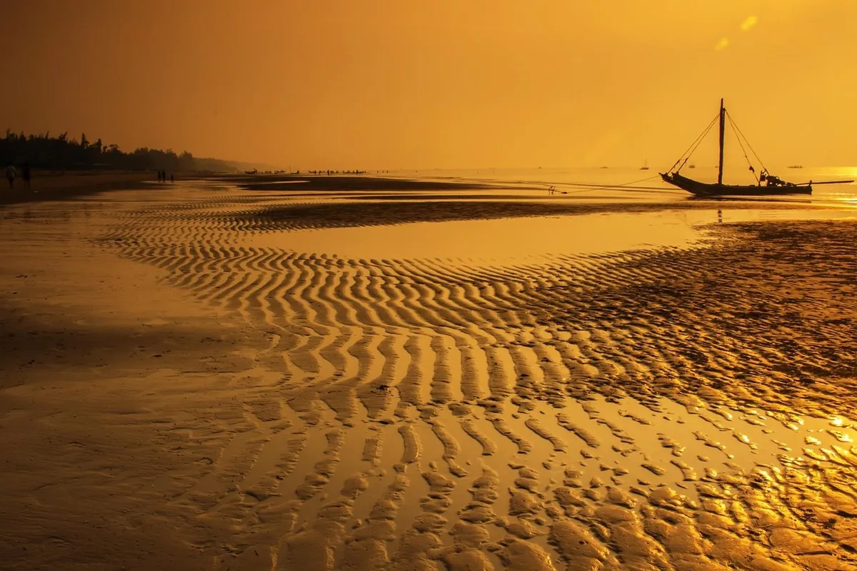 beach, boat, sand, sandy beach, low tide, sunset, sunrise, dusk, dawn, twilight, nature, orange sky, shore, seashore, coast, morning, silhouette, fishing boat,